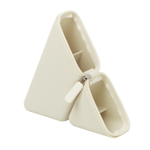 Beige white portable pen case opened up as a triangle shape pen stand, photographed against white background.