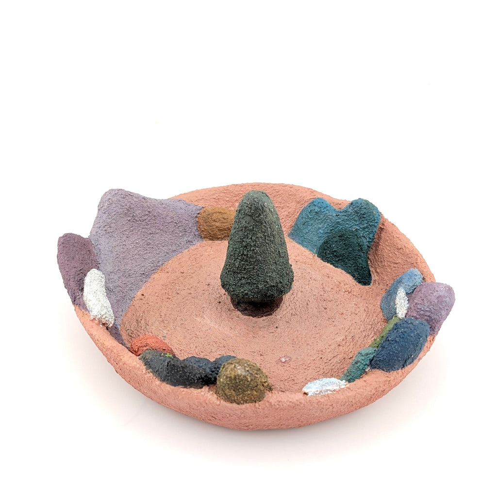 Accessory holder with colourful landscape on white background