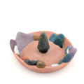 Accessory holder with colourful landscape on white background