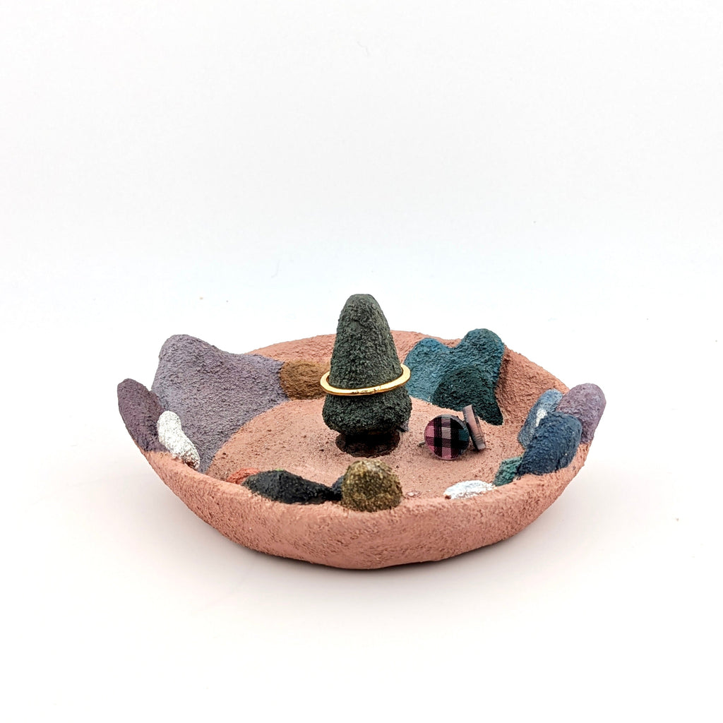 Accessory holder with colourful landscape on white background