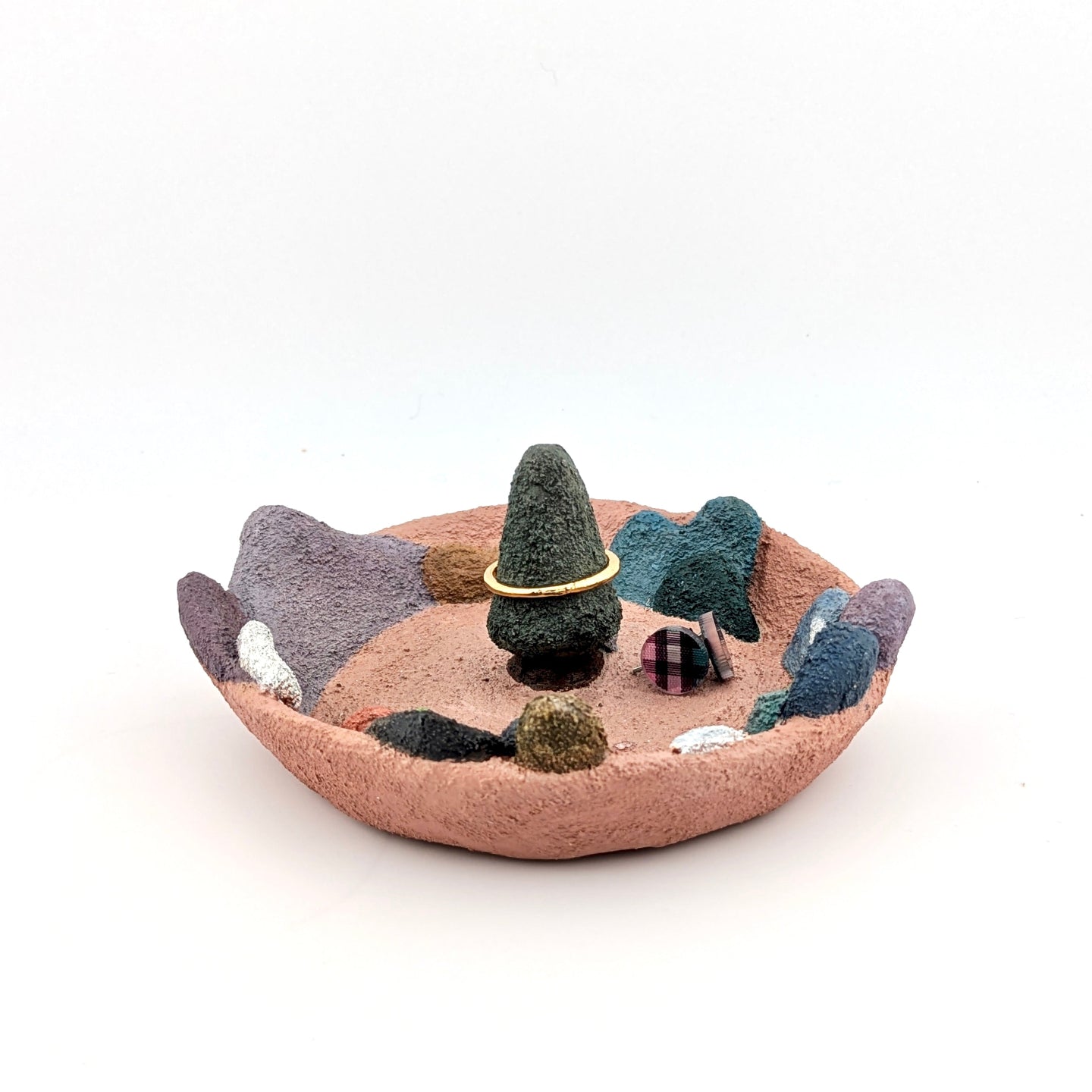 Accessory holder with colourful landscape on white background