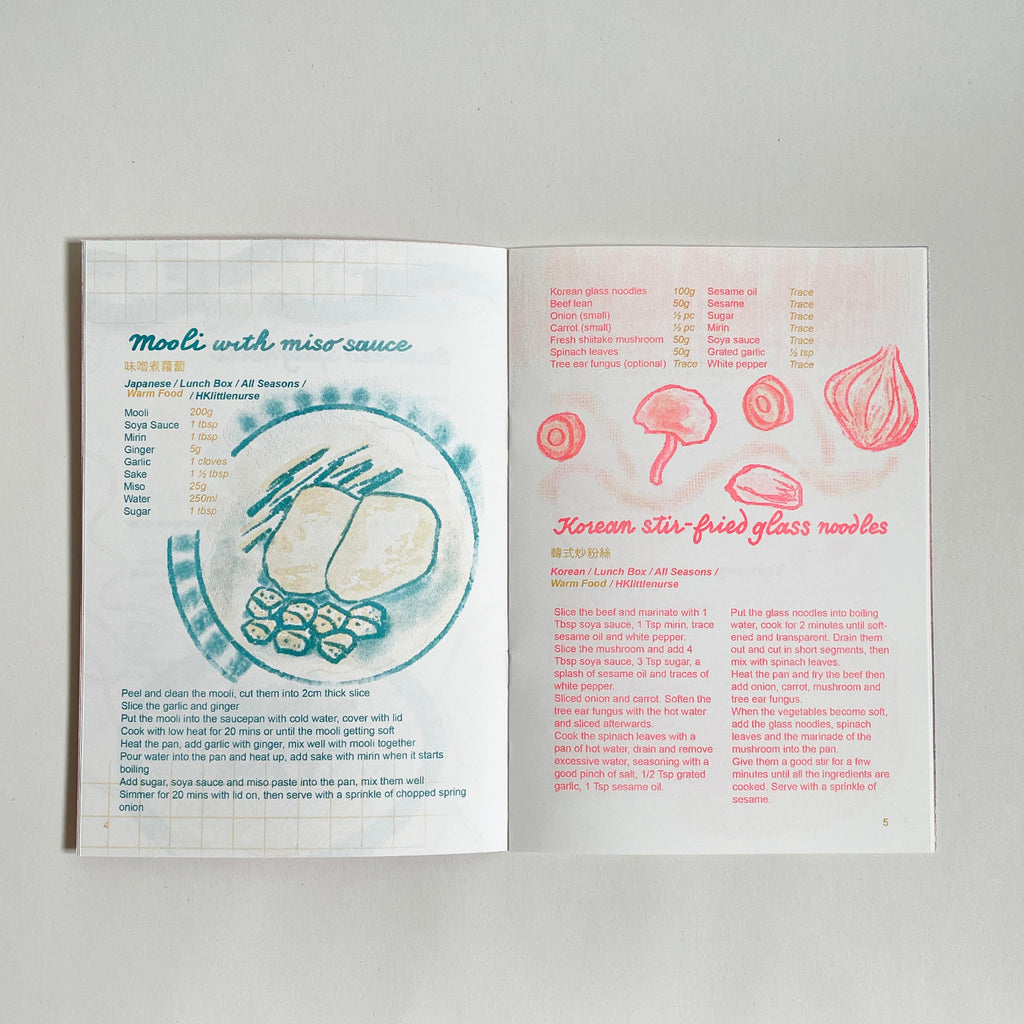 Open book with recipes for miso with miso sauce and Korean stir-fried glass noodles.