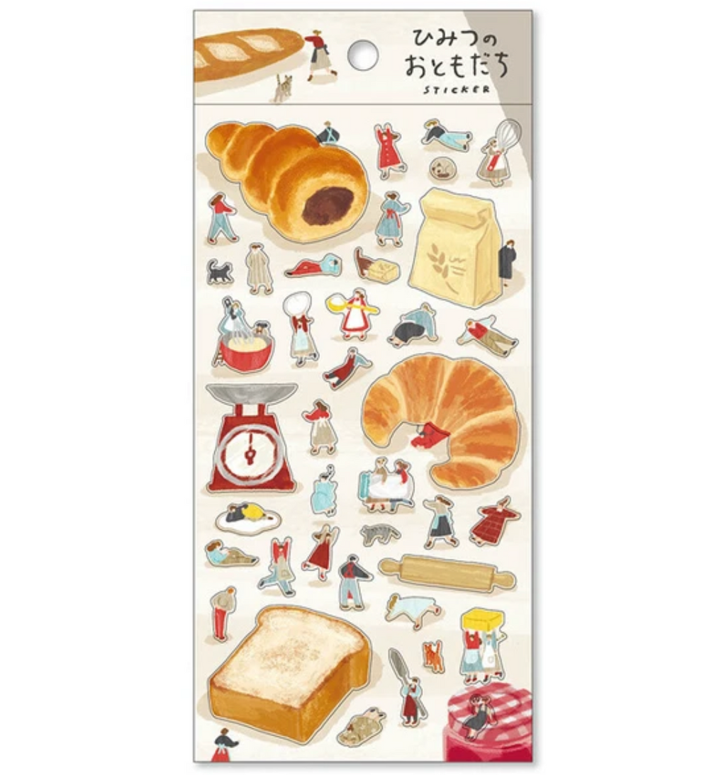 Sticker sheet with theme of baking with little friends on khaki back card placed over white background.