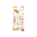 Sticker sheet with theme of baking with little friends on khaki back card placed over white background.