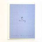 Back of light blue card artist name printed on white background.