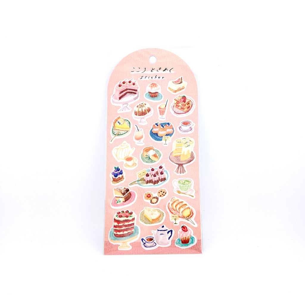 Sheet of cake-themed stickers on a pink back card, placed on white background.