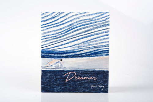Zine cover with blue and white design and 'Dreamer' text on a white background.