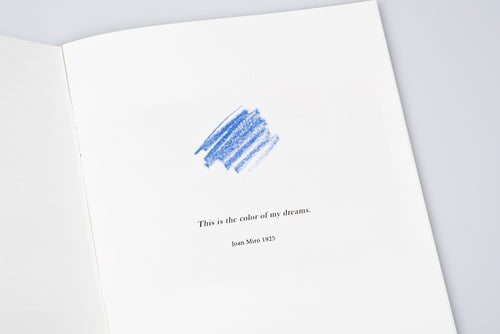 Inside page of zine, written with quote from Joan Miro "This is the colour of my dreams." and a dash of blue colour on white background.