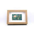 Colour pencil drawing of trees in nature, with wooden textured frame.