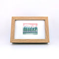 Colour pencil drawing of nature in wooden texture frame on white background.