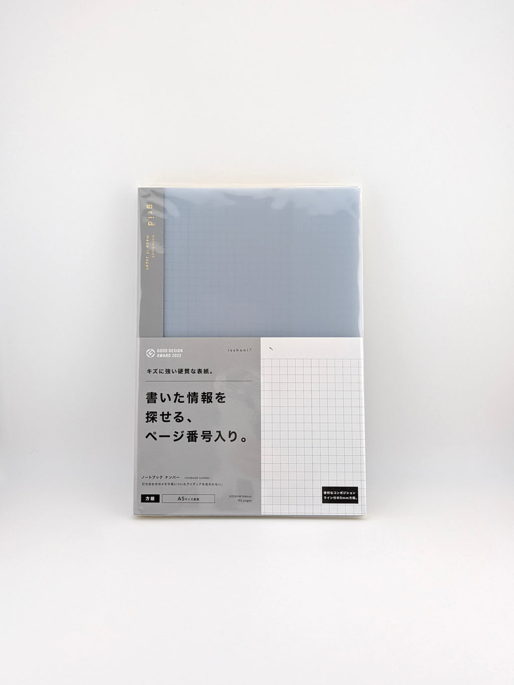 A Japanese memo pad or planner insert in its original packaging, featuring a light blue-gray cover with a white grid section and Japanese text on the front.