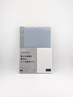 A Japanese memo pad or planner insert in its original packaging, featuring a light blue-gray cover with a white grid section and Japanese text on the front.