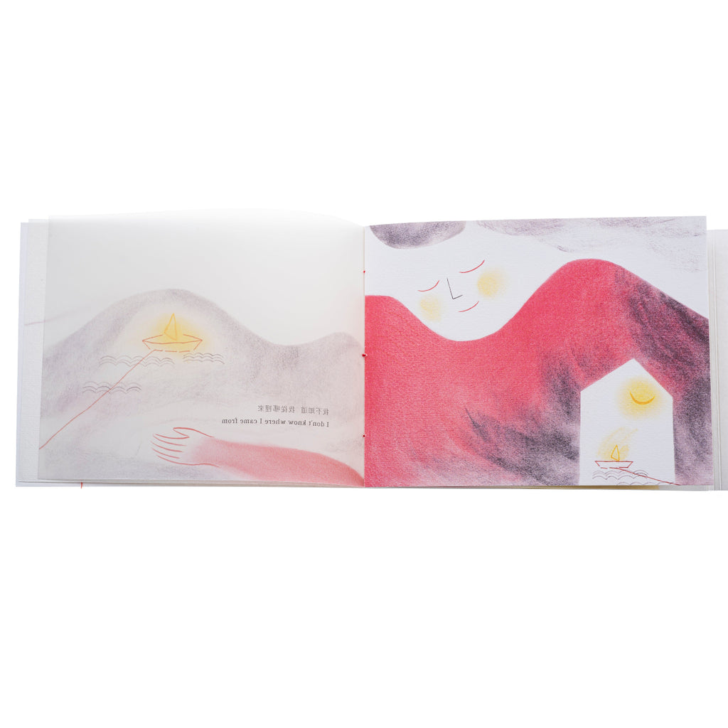 Inside pages of zine with images of mountain, boat and woman.