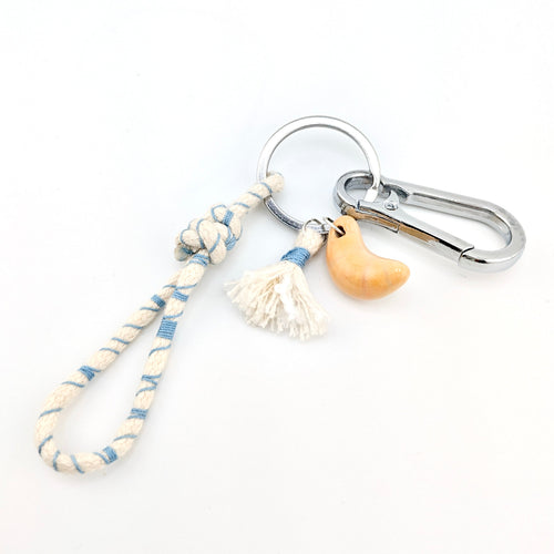 Ceramic croissant keychain handmade by Octoberfourteenth.