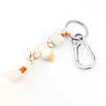 Keychain with shell and rope design on a white background
