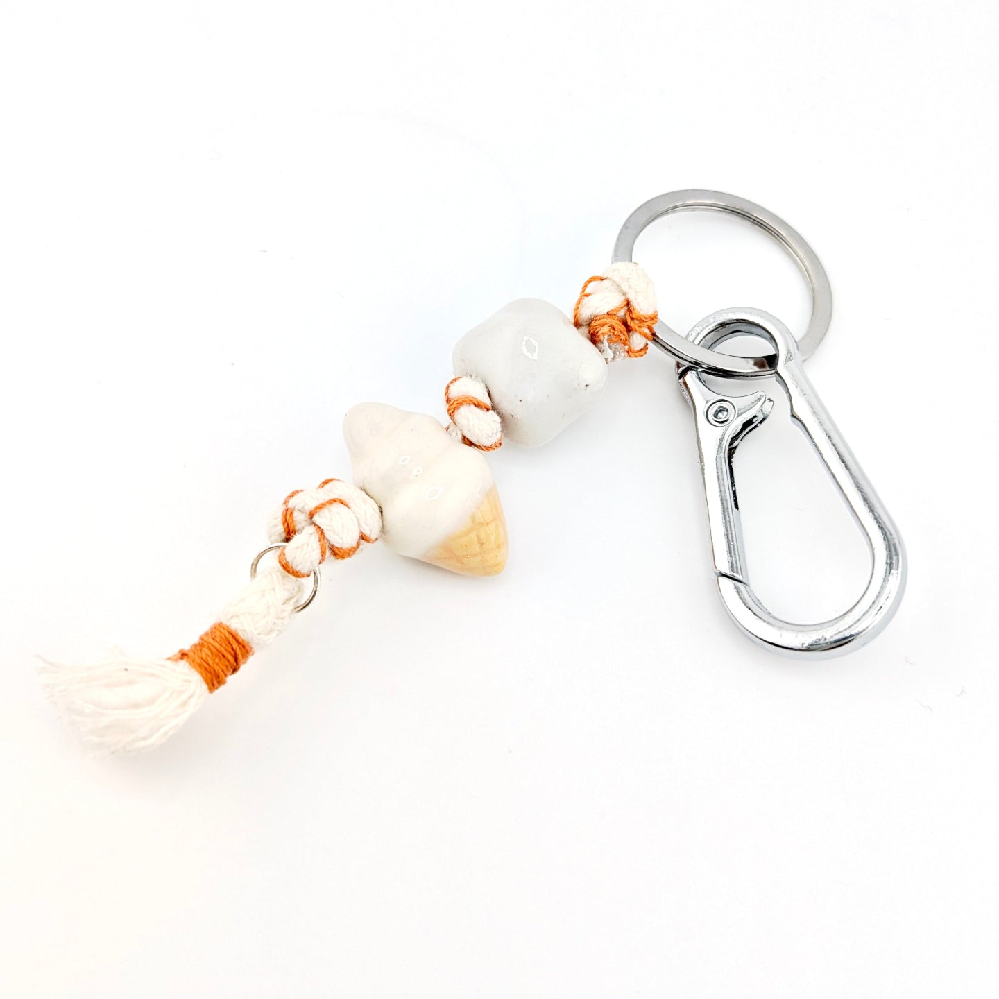 Keychain with shell and rope design on a white background