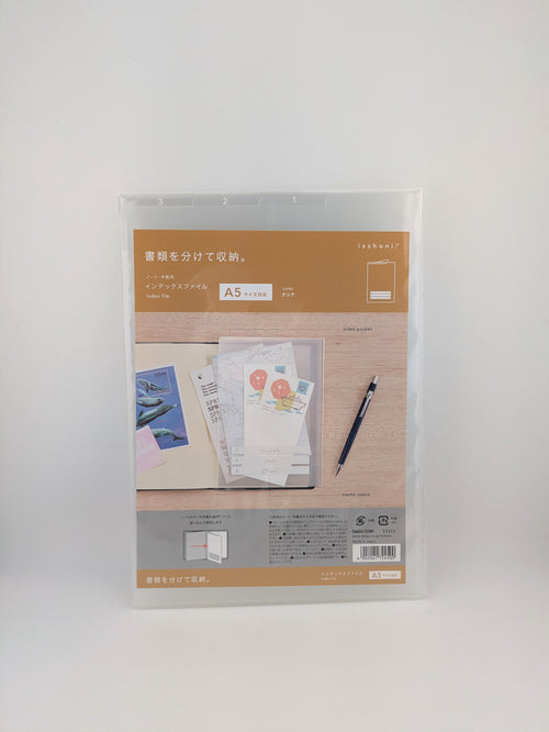 A packaged A5 file organizer with a clear plastic sleeve and a printed insert showing stationery examples, photographed against a plain light gray background.