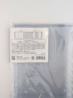 A clear plastic zippered pouch with a white product information label on the back, photographed against a plain white background.