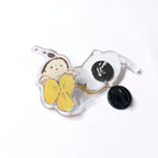Acrylic pin front and back with a kid face and a yellow flower.