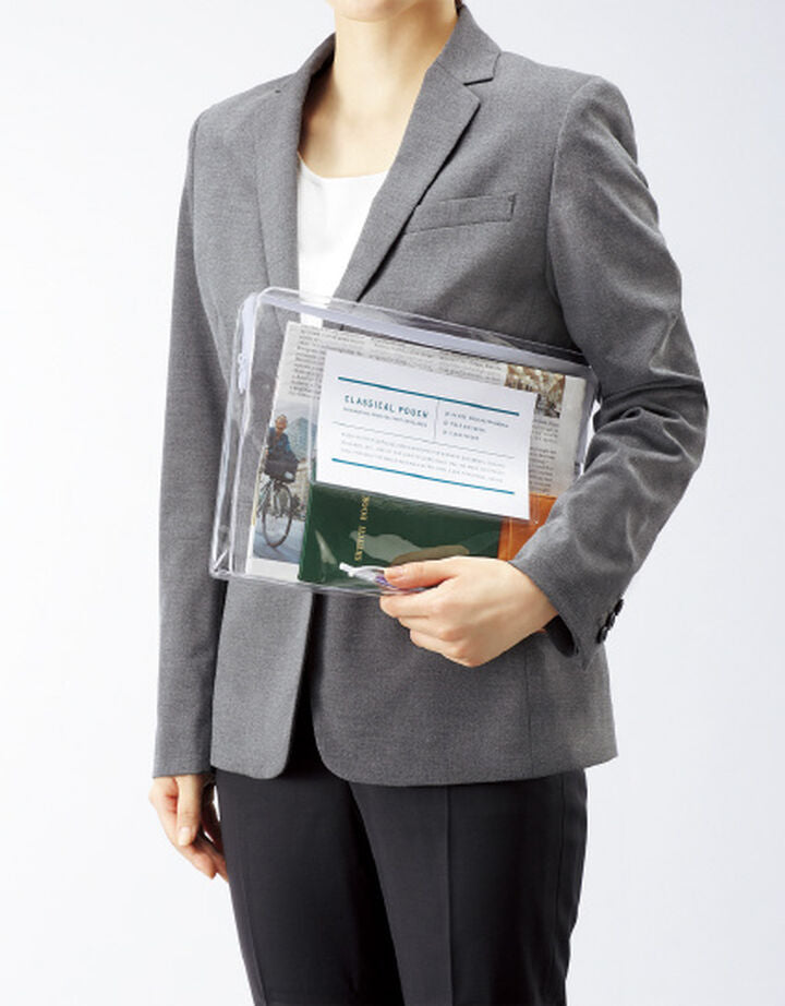 Model holding transparent case on white background.