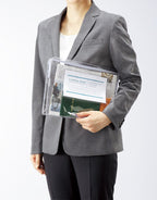 Model holding transparent case on white background.
