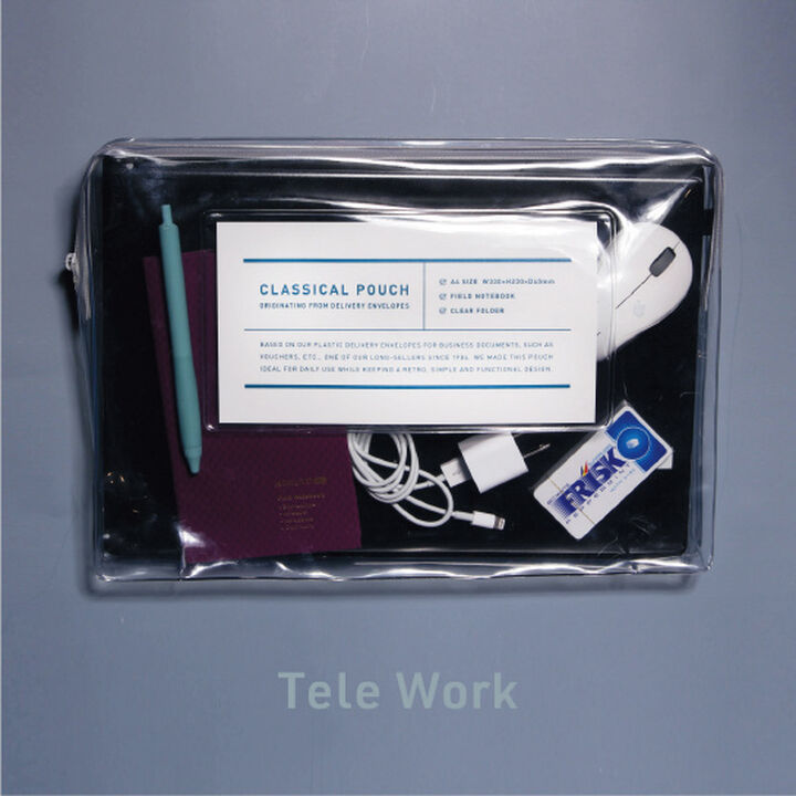 Transparent case with laptop, mouse, cable and stationery on grey background.