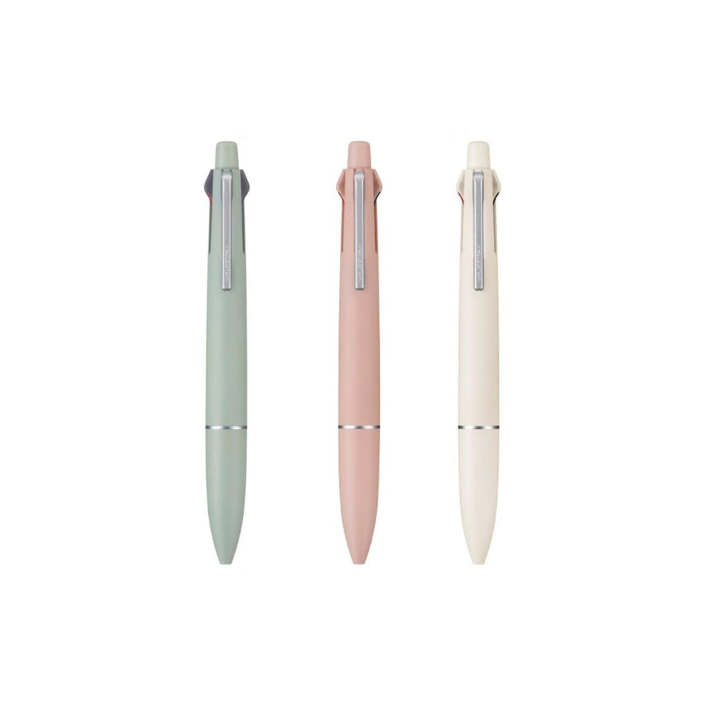 Multi-colour pens in sage green, coral & cream white on white background.