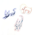 Vinyl stickers of animal illustrations in yellow, pink and purple on white background.